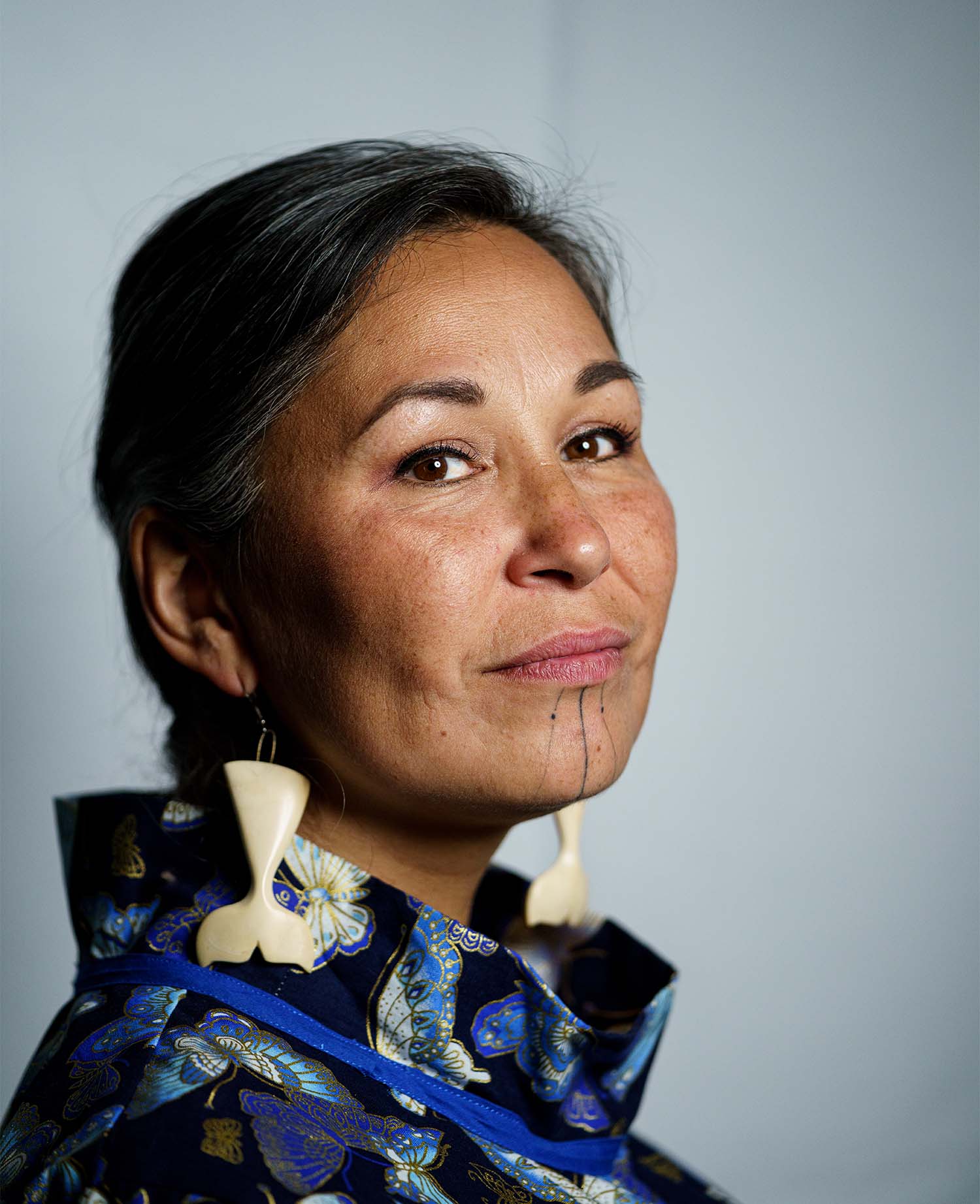 Headshot of Bernice Kootoo Clarke wearing earrings shaped like whale tails