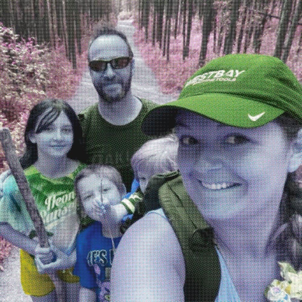 A family selfie taken while hiking